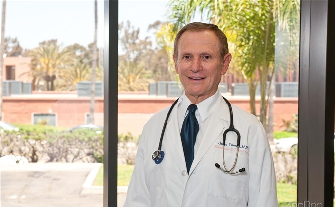 Dr. Sidney H. Levine, MD in his white coat at the North County Orthopedic Medical Group office in San Diego.